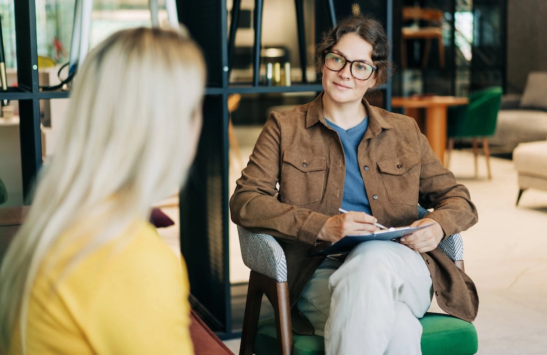 A person participates in therapy for addiction treatment.
