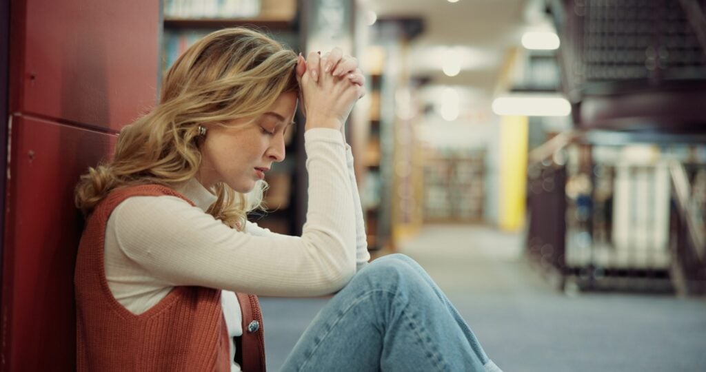 Woman struggling with addiction in college students.