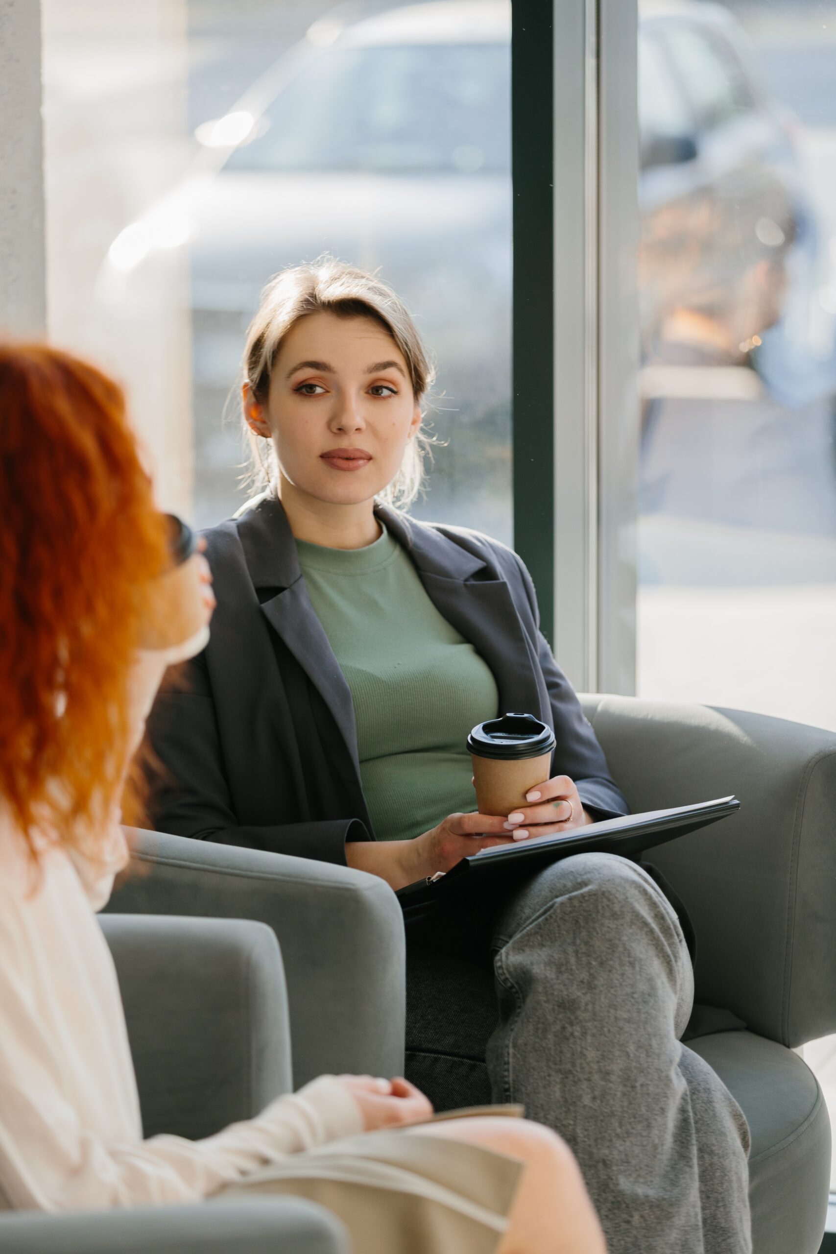 Woman talking with therapist at cocaine rehab.