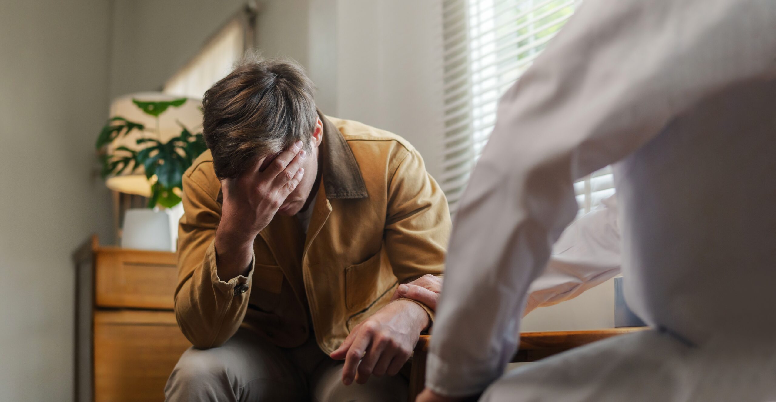 Man struggling with depression at a depression treatment nyc​.