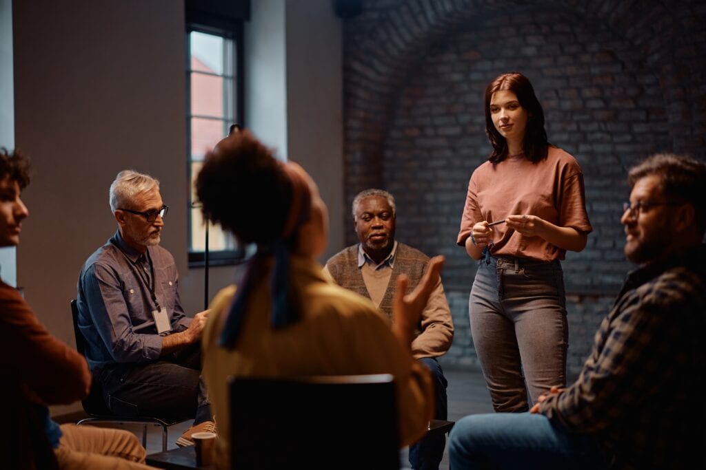 Therapy group of men and women near lower east side drug rehab.